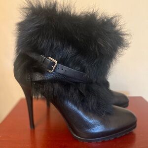 Black stiletto heel ankle boots with belt detail and faux fur